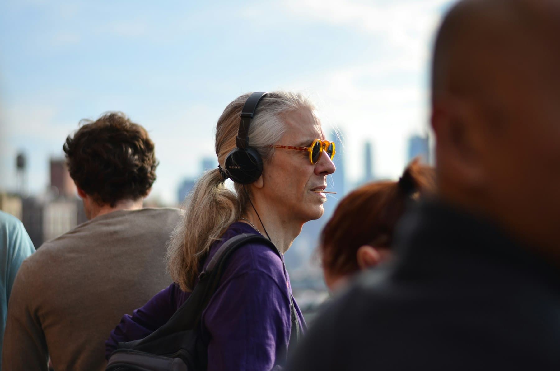 Traveler listening while out in the city